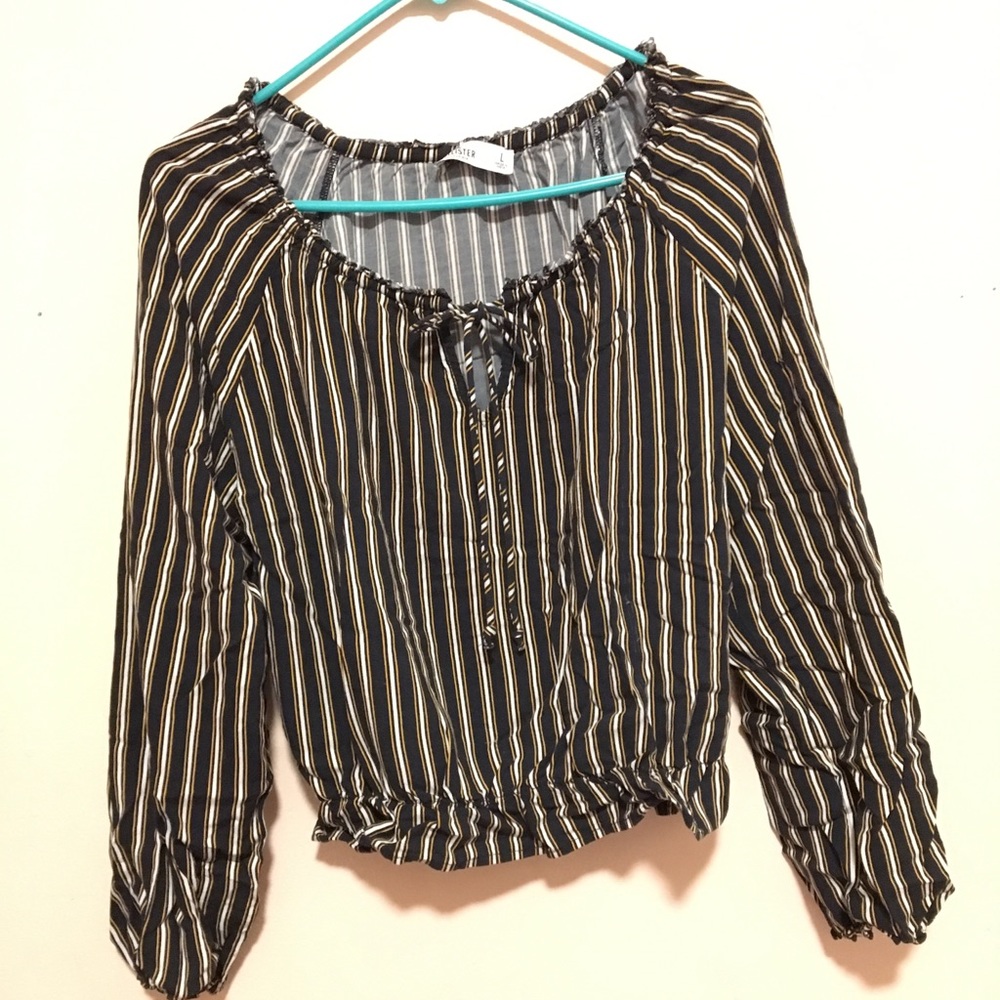 This is a shirt that has blue and yellow strips